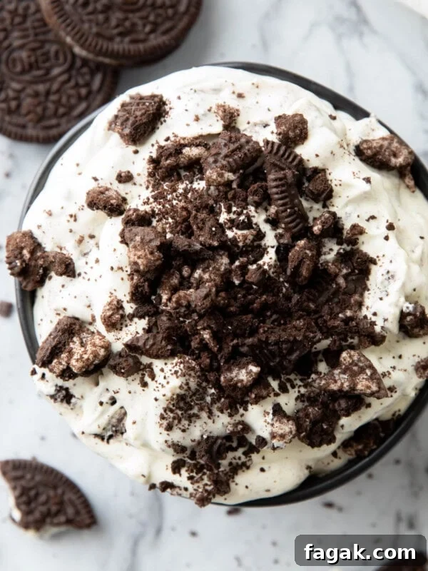Close up of thick and creamy Oreo Fluff served in a bowl with crushed cookies on top