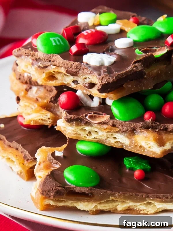 Close up of Christmas Crack in pieces on parchment paper