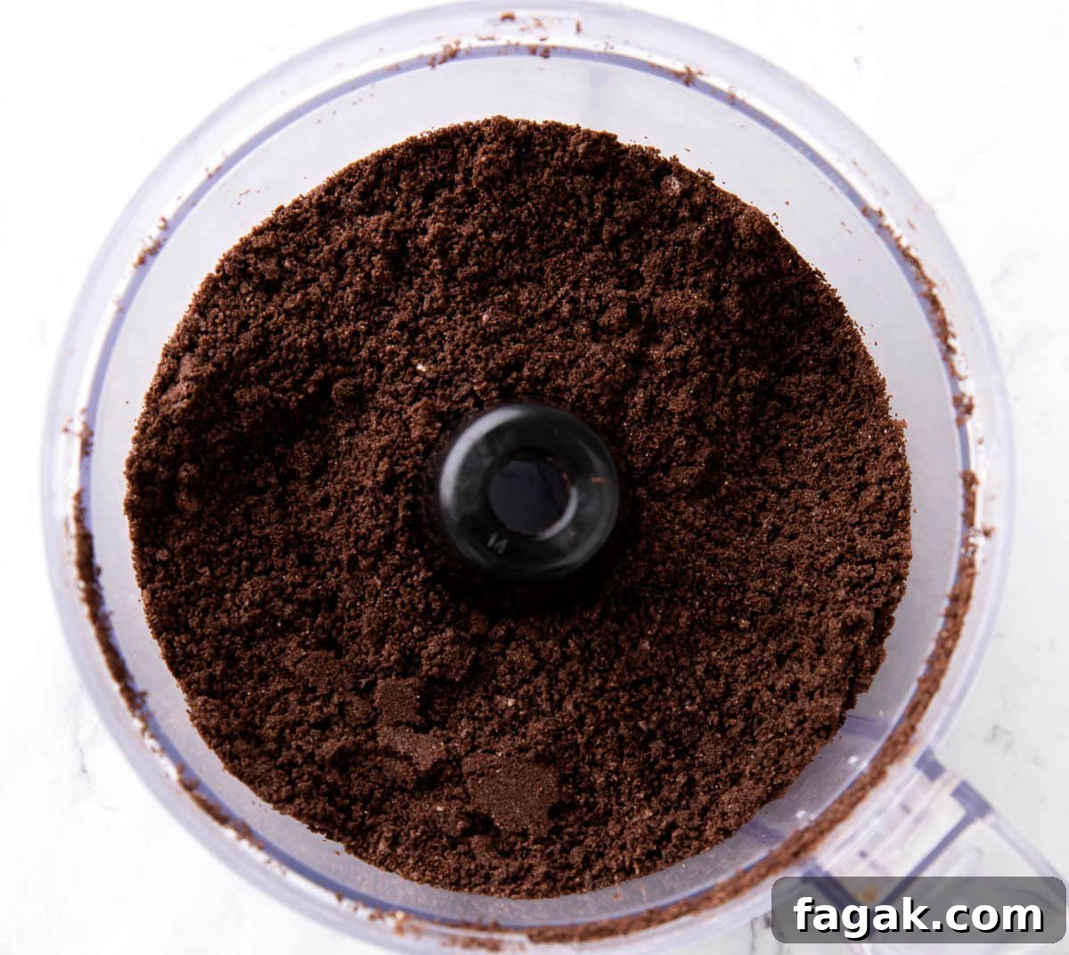 One photo showing How to Make Oreo Balls - crushed Oreo cookies in a food processor.