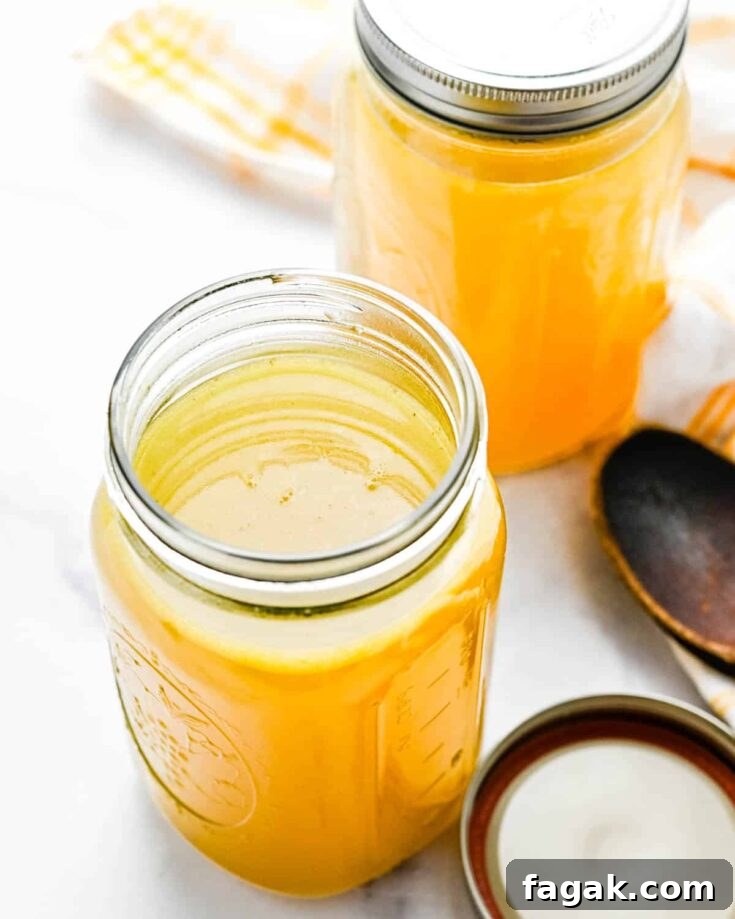 Two jars of homemade turkey stock.