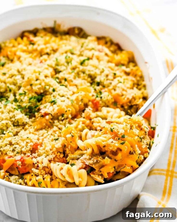 Spooning up Southwestern turkey casserole made with leftover turkey.