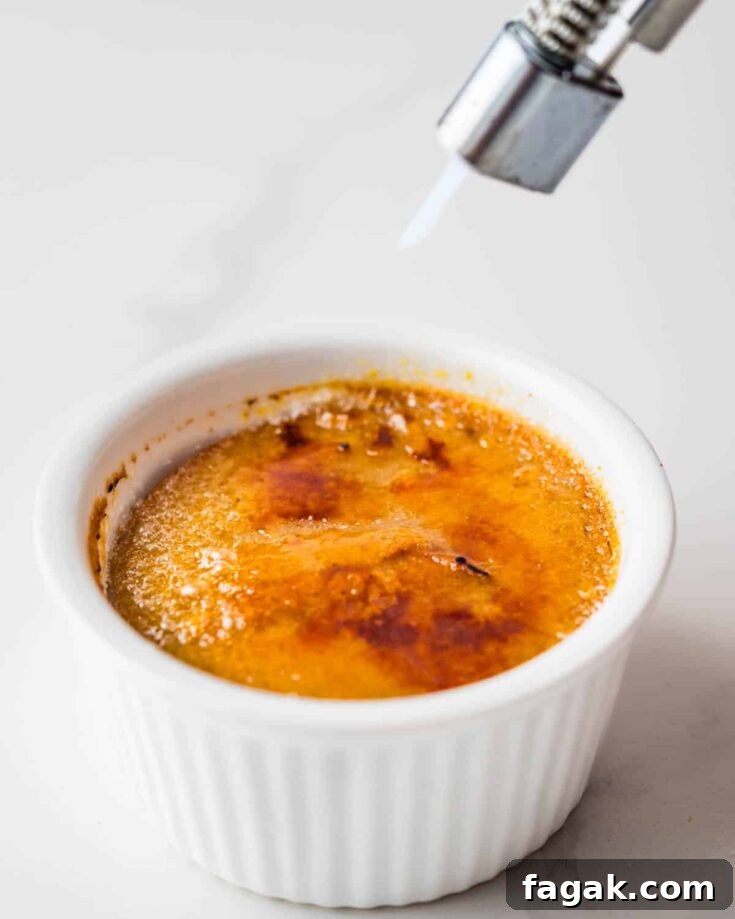 Torching the sugar on a pumpkin custard.