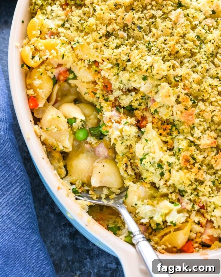 Scooping up some of the leftover ham casserole.