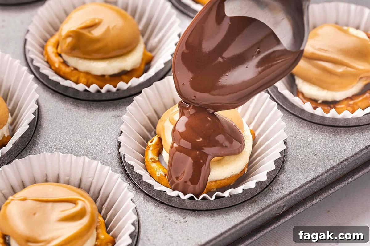 A spoon topping chocolate pretzel banana bites with melted chocolate.