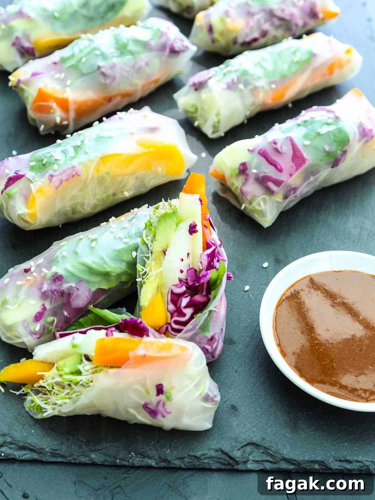 Crispy Vegetable Spring Rolls Recipe with Dipping Sauce 3 A sliced open spring roll made with rice paper wrapper stuffed with colorful veggies.