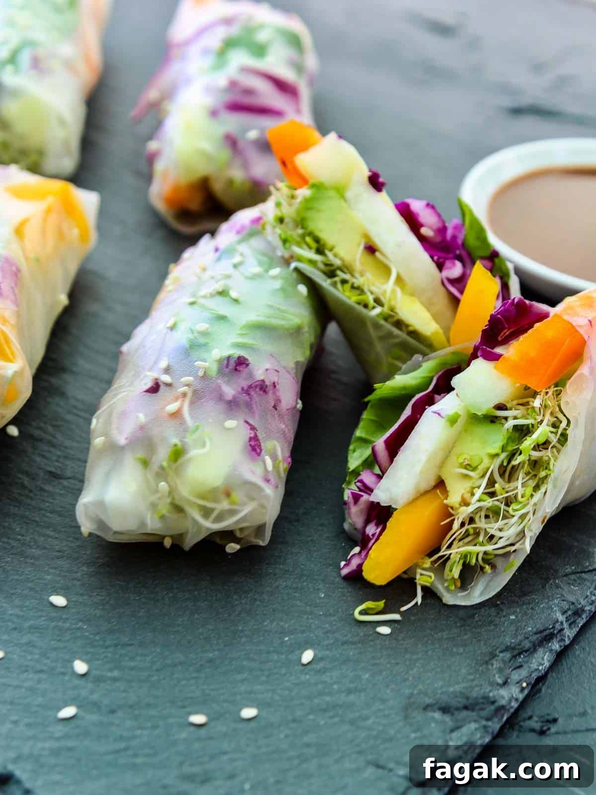 Crispy Vegetable Spring Rolls Recipe with Dipping Sauce 5 Close up of a sliced open spring roll with colorful veggies inside