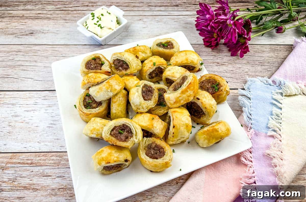 Sausage Rolls on a white plate.