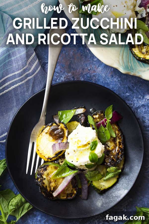 Grilled squash and cheese on a black plate with text overlay Grilled Zucchini and Ricotta Salad.