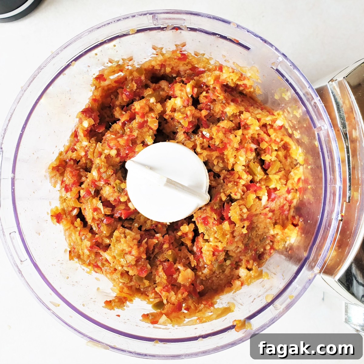Jalapeño Chili Paste Recipe: Add Bold Spice to Your Meals 6 Chili, onion and garlic after being blended in a food processor.