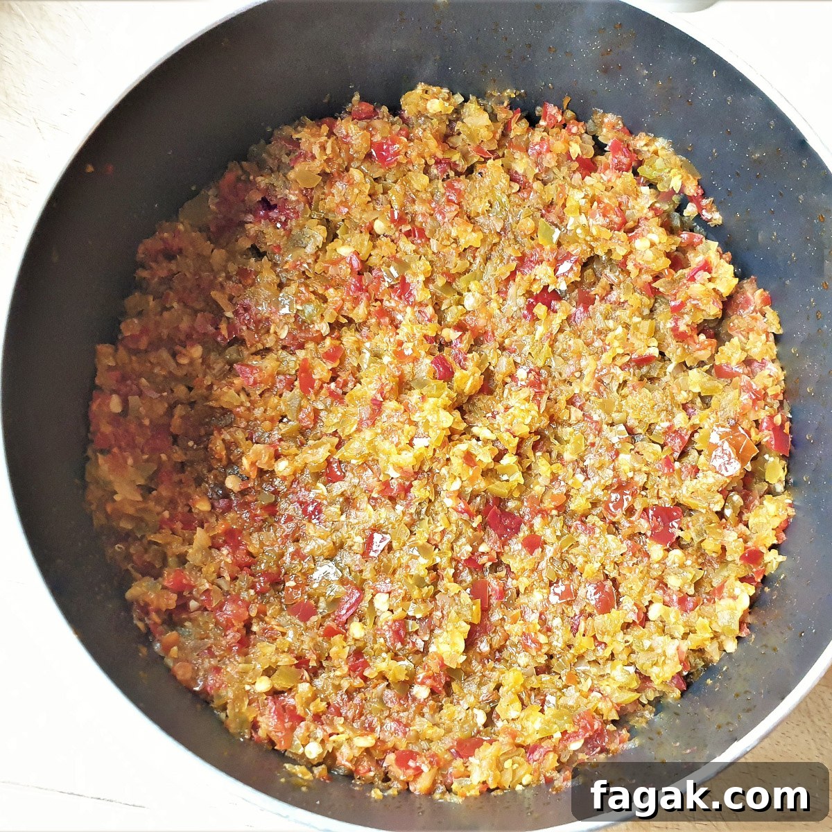 Jalapeño Chili Paste Recipe: Add Bold Spice to Your Meals 7 Finely processed chili, garlic and onion frying in a pan.