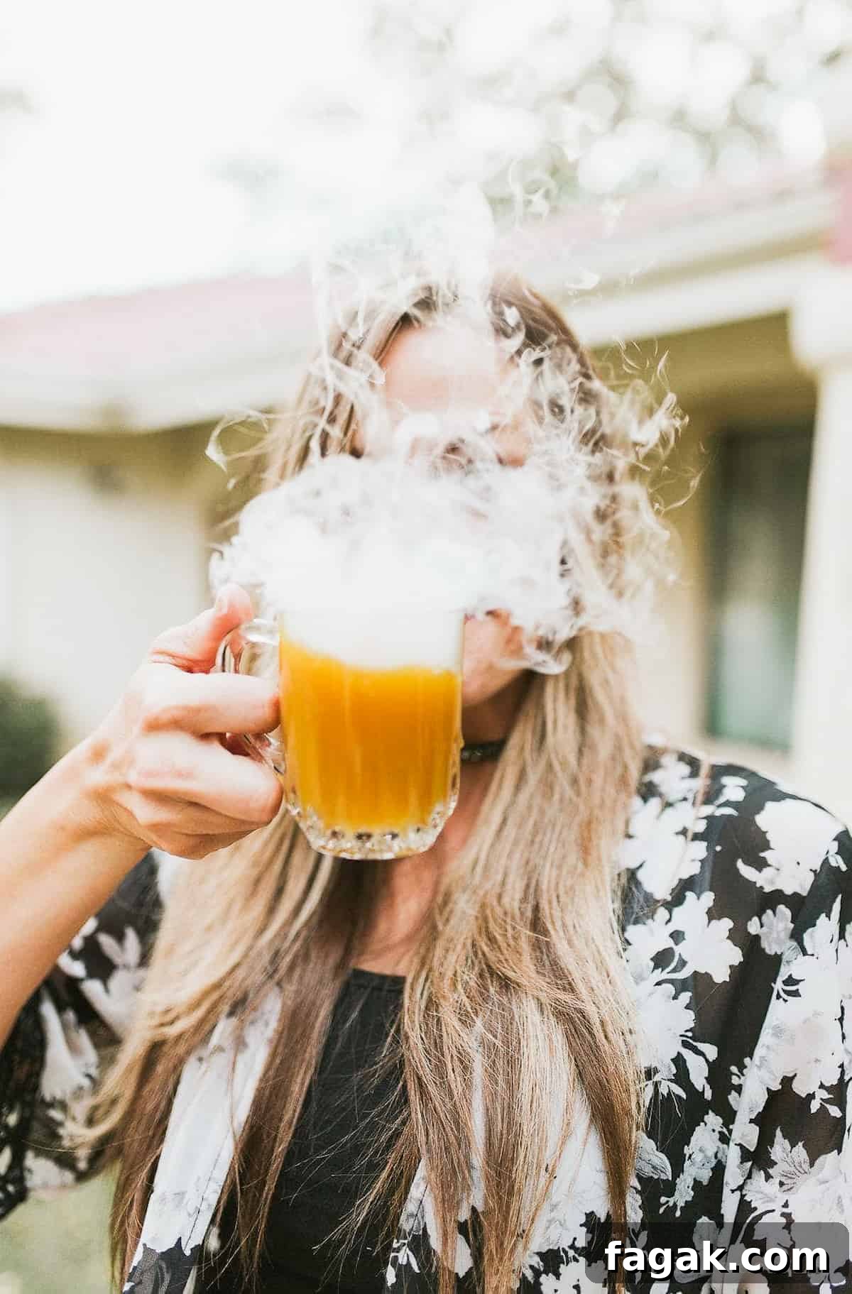 Pumpkin punch in front of a face smoking