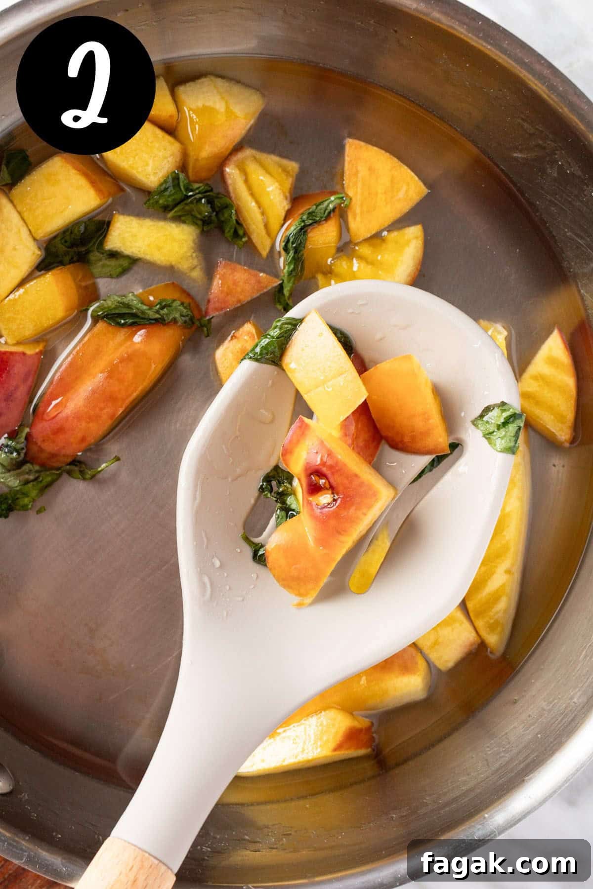 Straining out the peach chunks and basil leaves from the peach syrup.