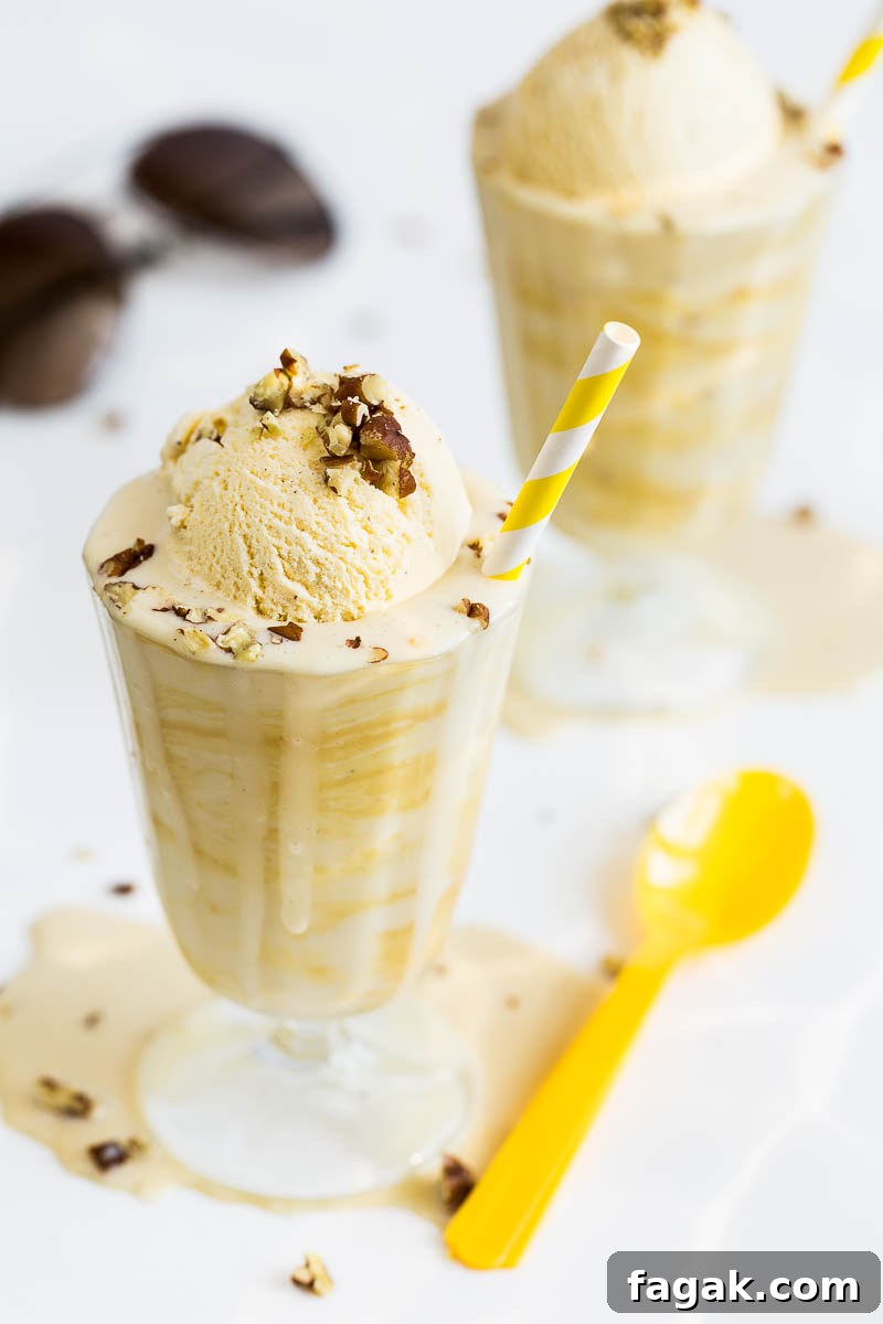 Ice cold and ready for summer, this dairy free banana milkshake with peanut butter is also vegan, perfect for a hot day and anyone's diet, it's a summer drink that will keep you cool and your tastebuds tantalised. Made with any non-dairy milk, frozen banana, a smattering of peanut butter and topped with crushed pecans, it's even more delicious than it looks.
