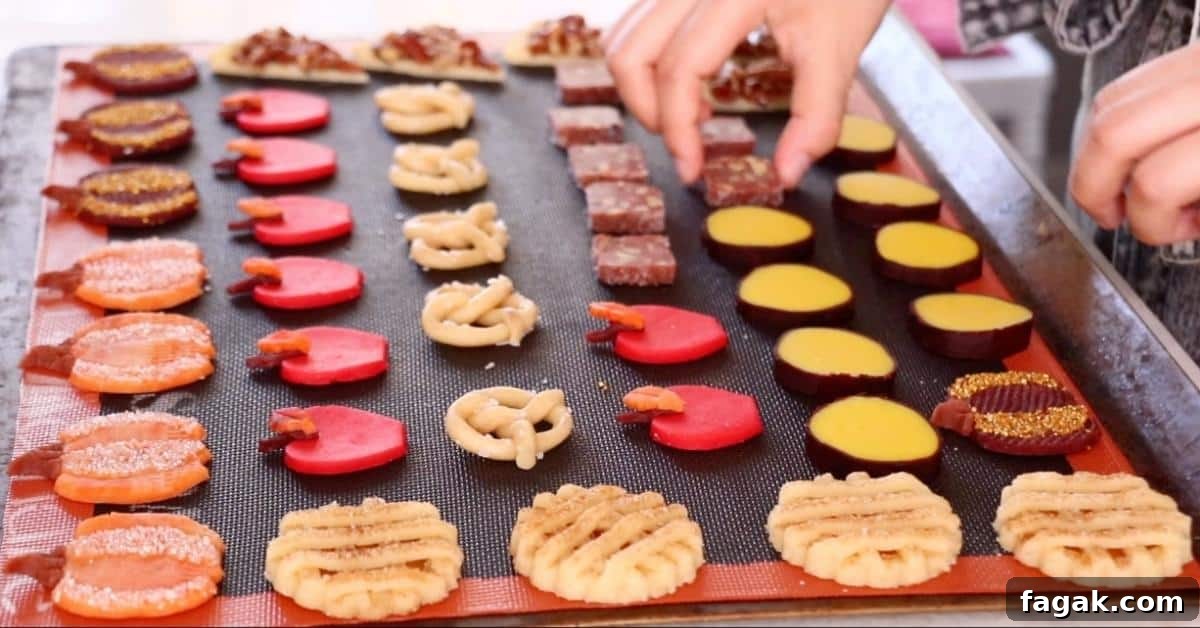 placing fall cookies on a tray