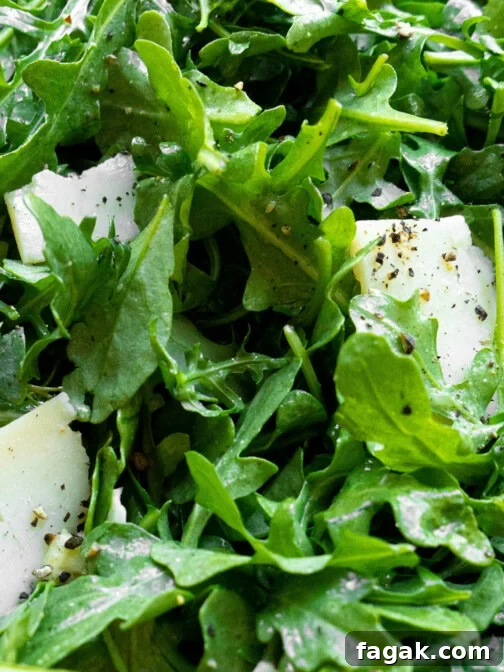Arugula with cracked pepper and shaved parmesan.
