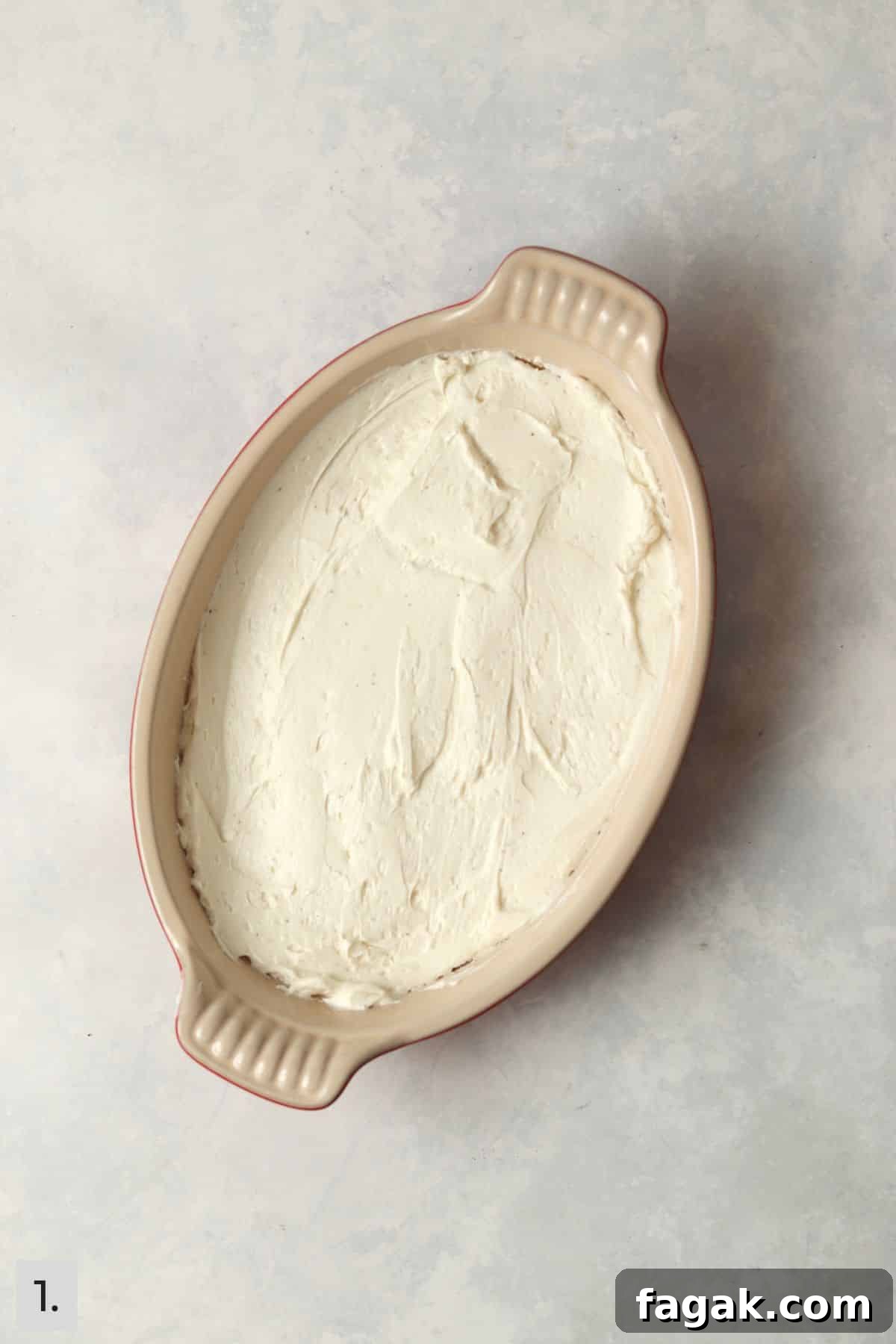 Whipped cream cheese and goat cheese spread in dish.