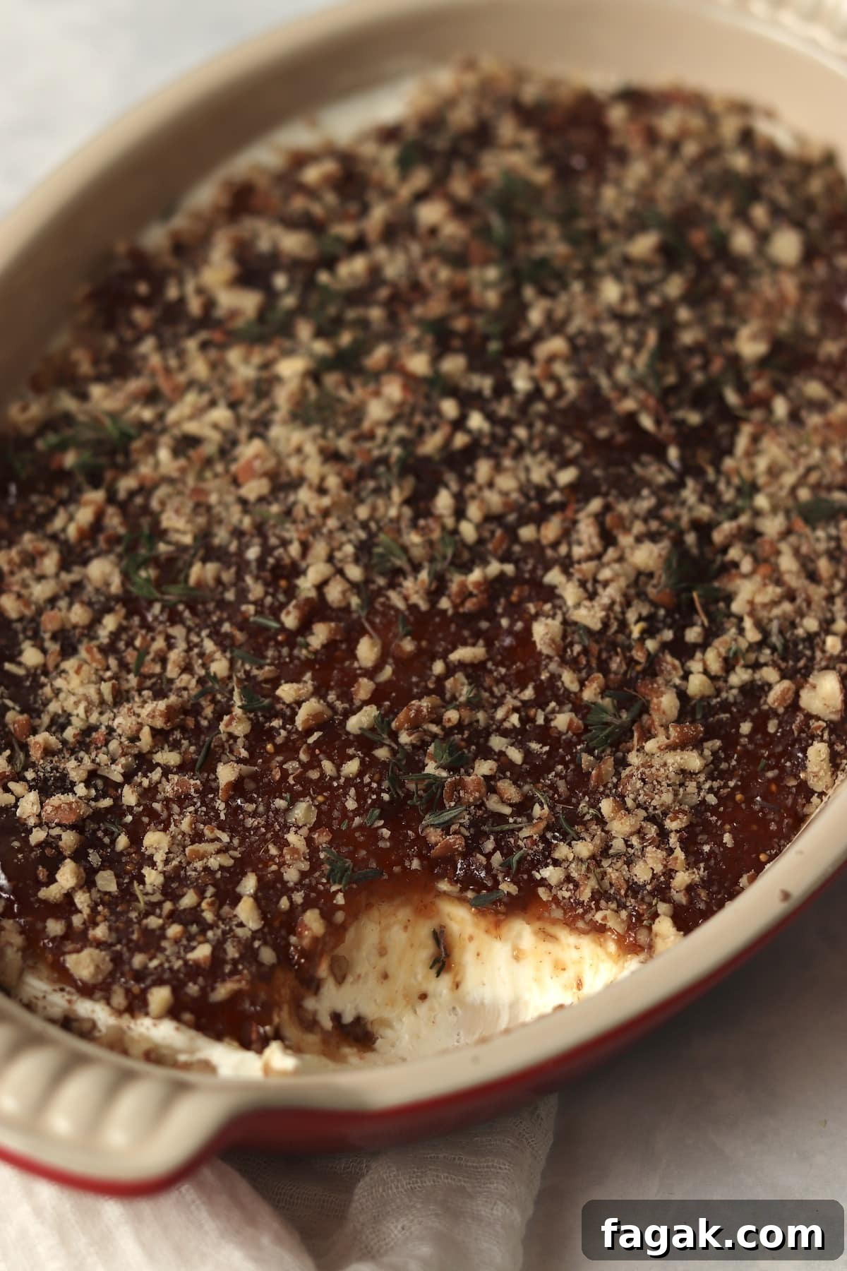 Goat cheese fig dip appetizer in a baking dish.
