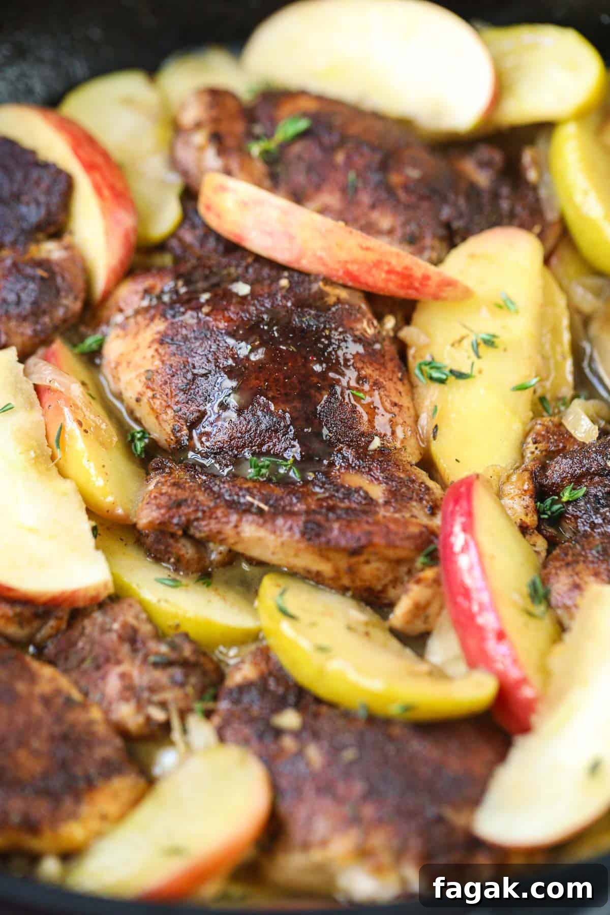 one pan apple cider chicken in a cast iron skillet.