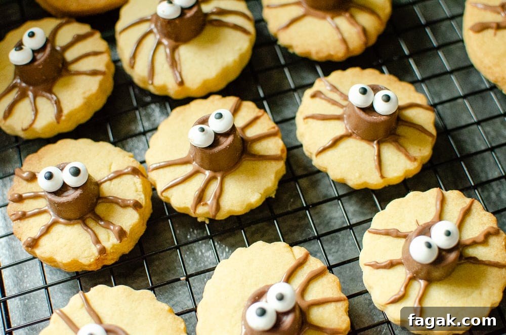 Cute Spider Halloween Biscuits on marble worktop using Rolo Chocolate and edible sweet eyes