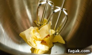 Whisk in softened butter in silver bowl