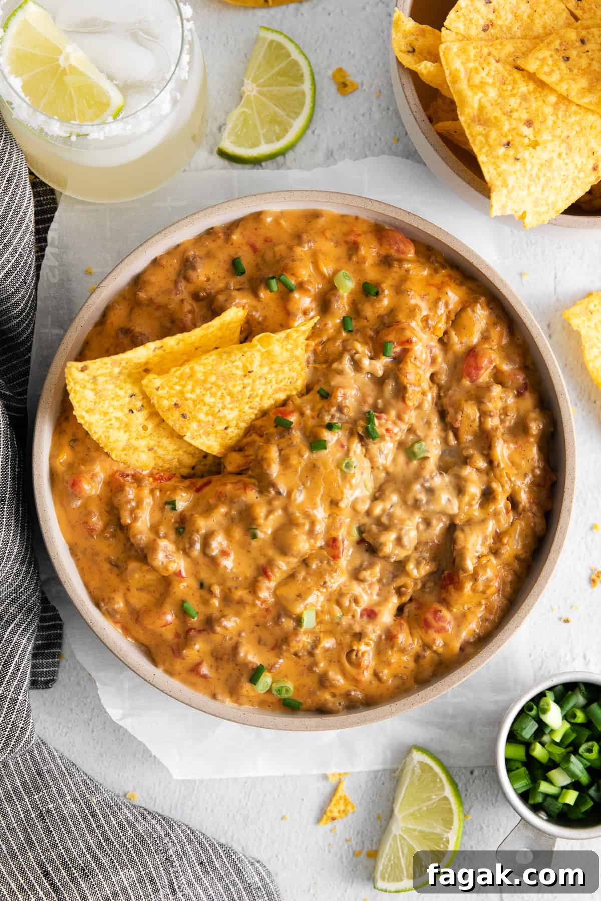 Rotel dip in a bowl with chips.