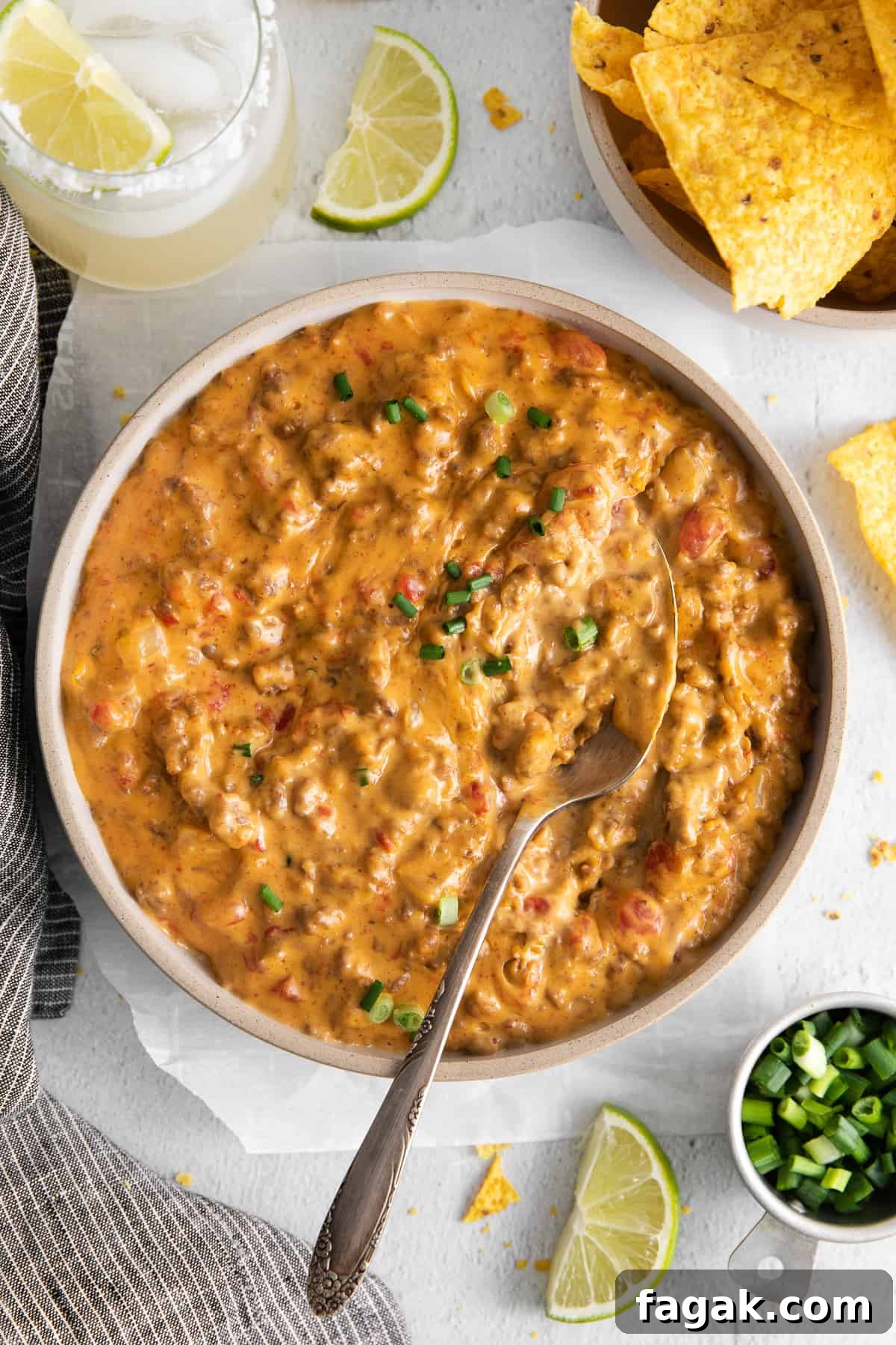 Rotel dip in a bowl with a spoon.