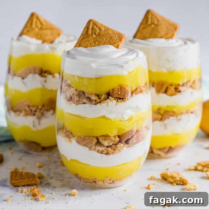 Three lemon parfait cups with one in front.
