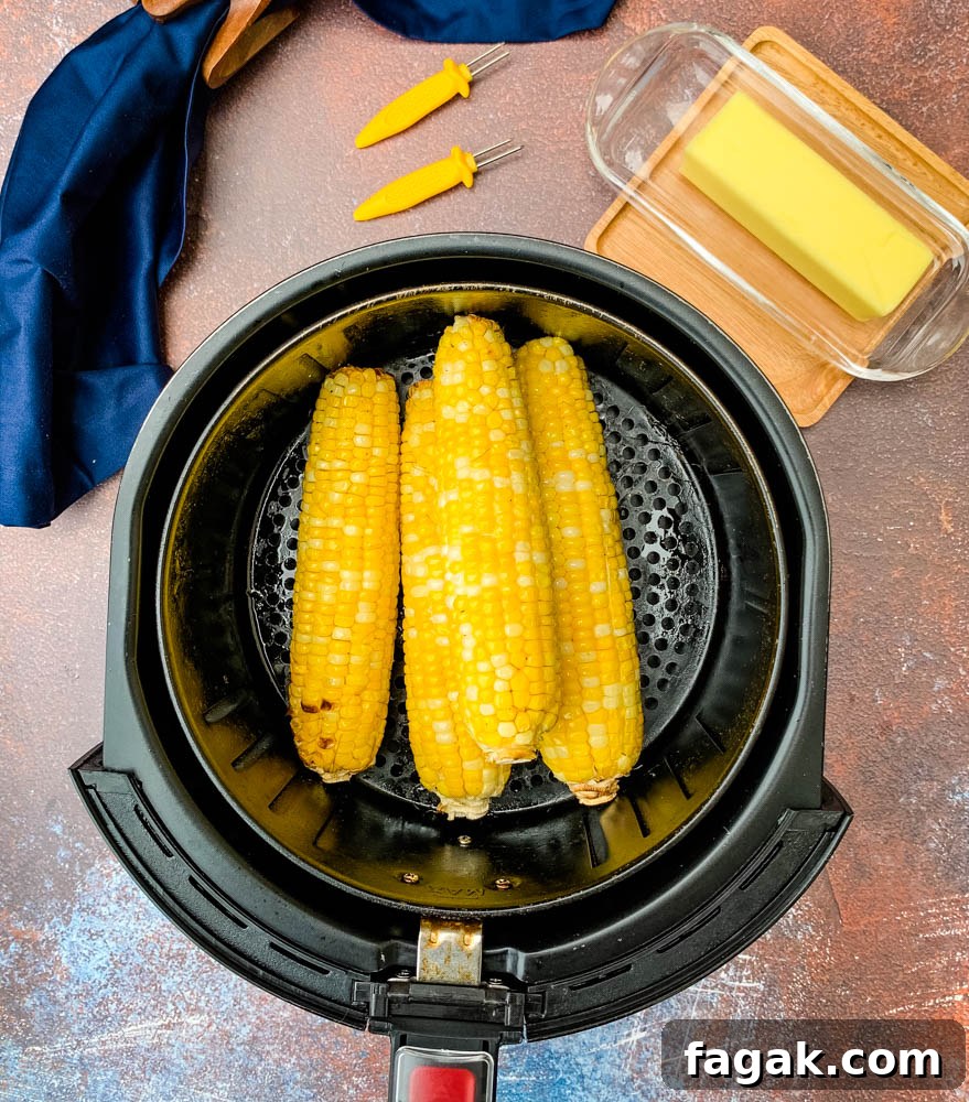 cooked corn on the cob in an air fryer basket