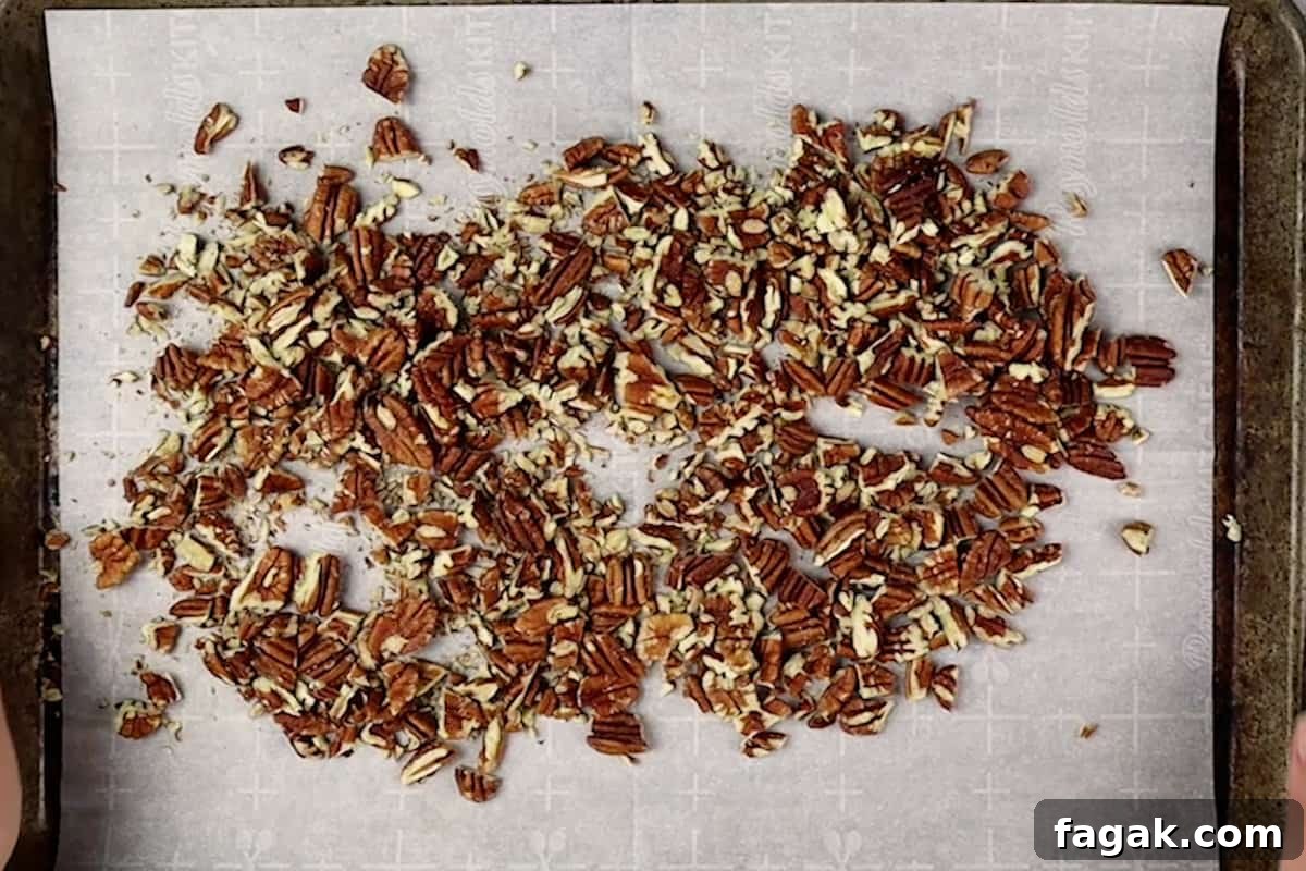 toasted pecans on baking sheet
