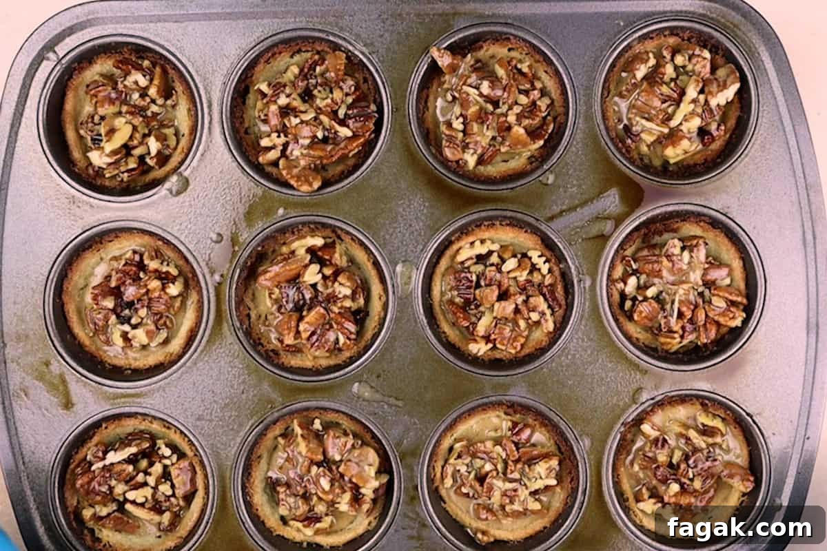 pecan pie filling added to partially cooked crusts.