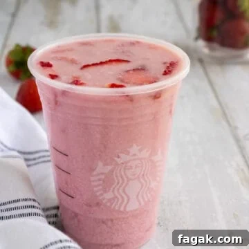 Cup of Starbucks pink drink.
