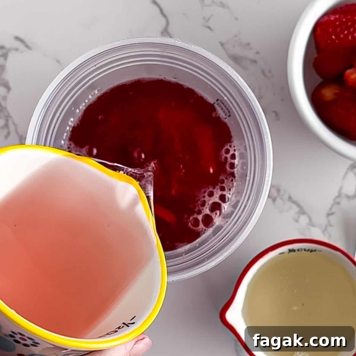 Pouring in the juice with the tea.