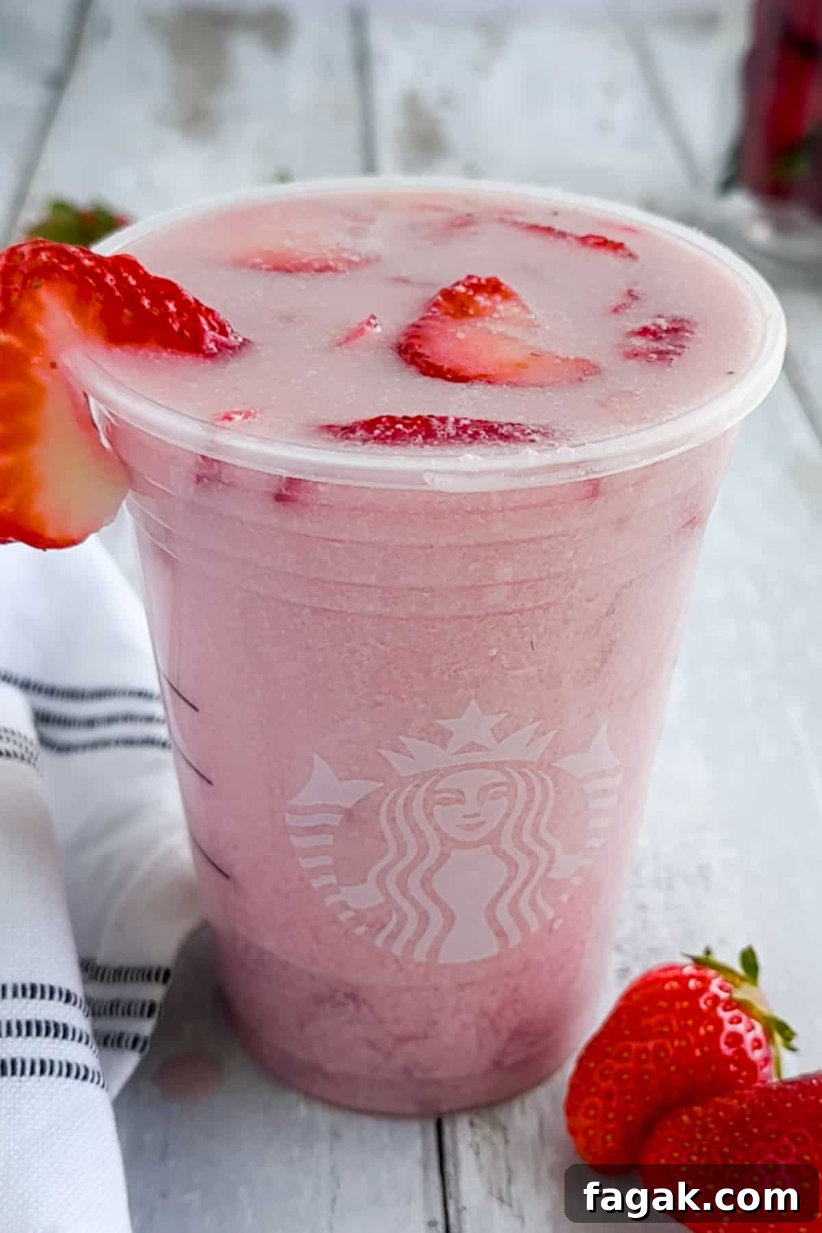 A Starbucks pink drink on a table.