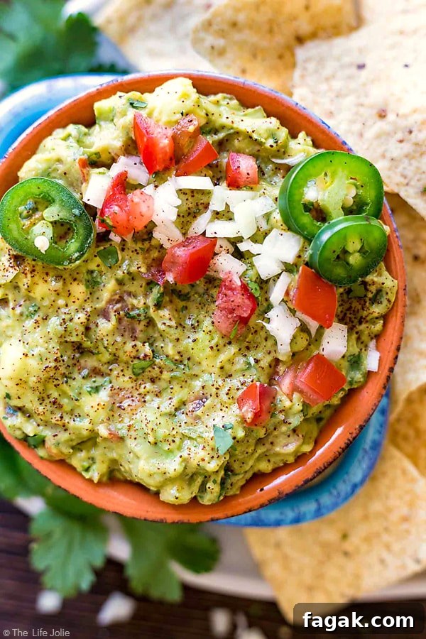 It's always a good idea to have an easy guacamole recipe up your sleeve and this one is seriously the best- fantastic, zesty flavor with an awesome secret ingredient to helps take the guacamole to the next level. It's a healthy snack for any celebration or game day!
