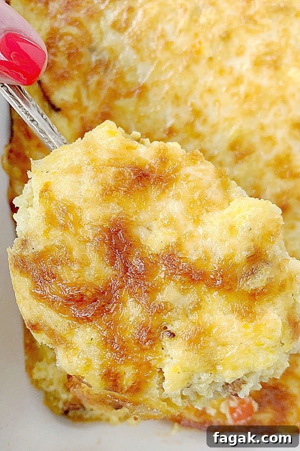 spoonful of loaded grits breakfast casserole