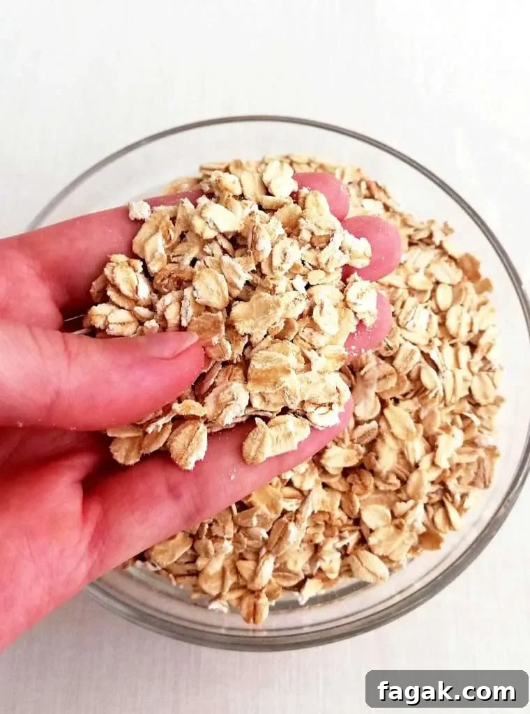 oatmeal cookies rolled oats in hand