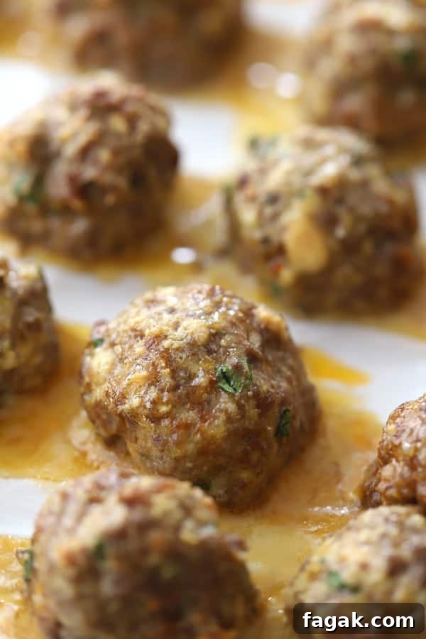 A tray full of meatballs for making penne and meatballs.