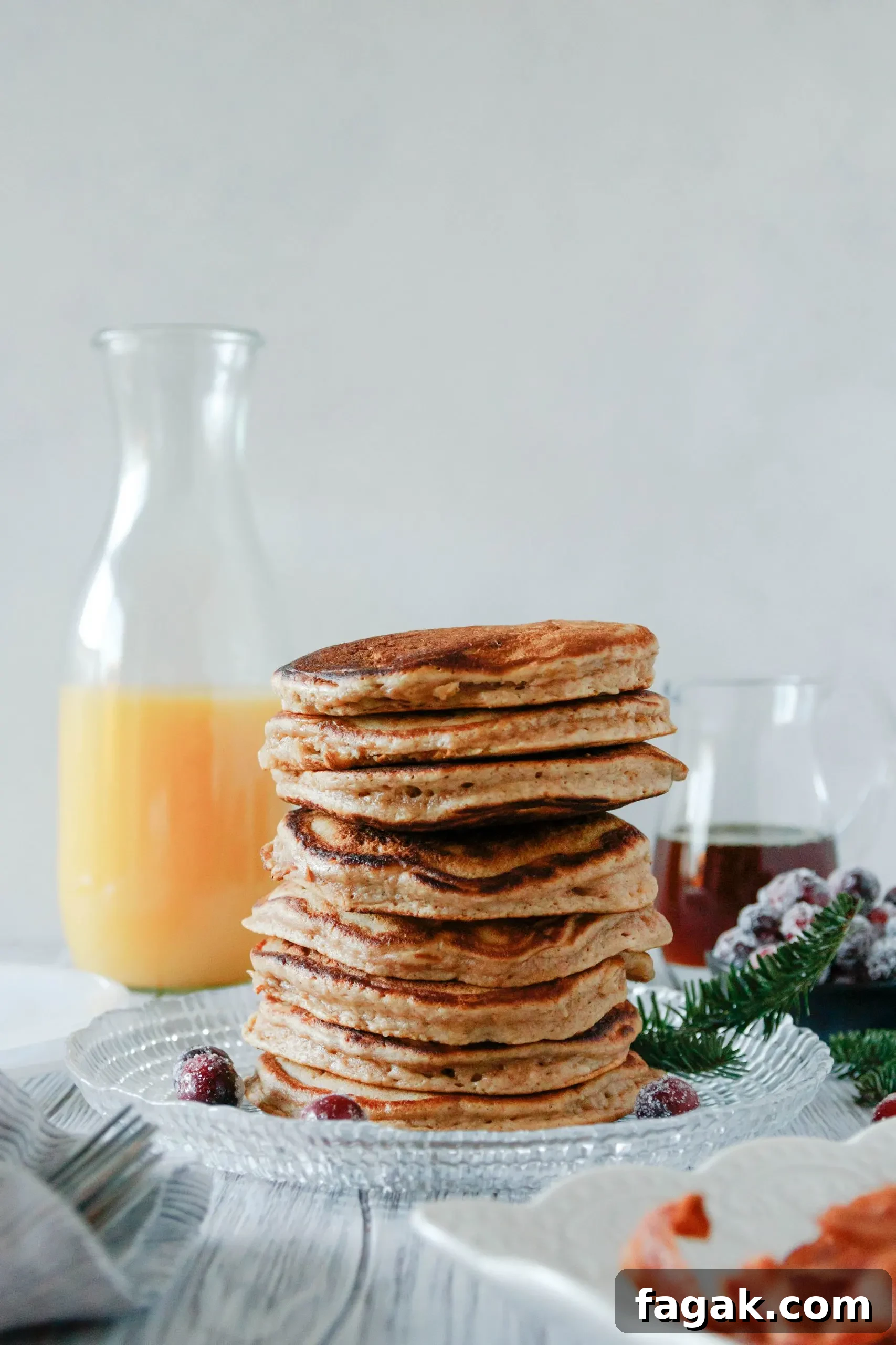 a big stack of fluffy eggnog pancakes ready to serve