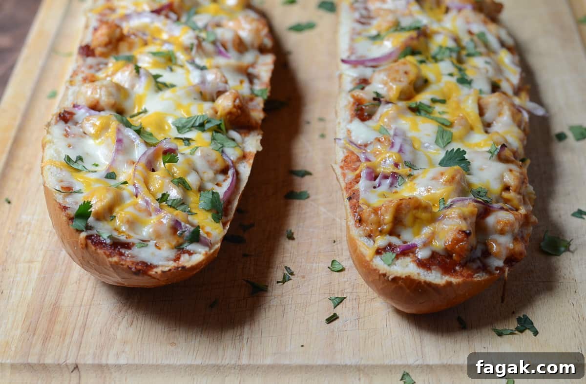 French bread pizza topped with cilantro on a cutting board.