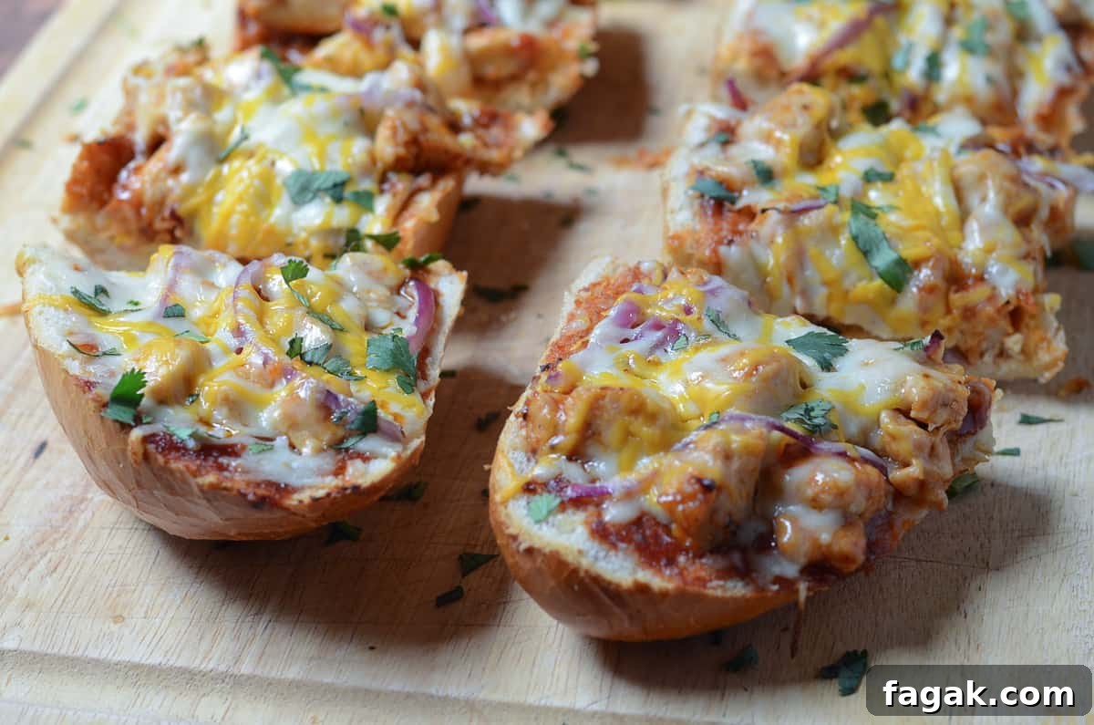 BBQ Chicken French Bread Pizza sliced on a cutting board.