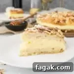 A recipe for bee sting cake--a delicious German dessert made with a yeasted cake topped with honey and almonds and filled with sweet pastry cream.