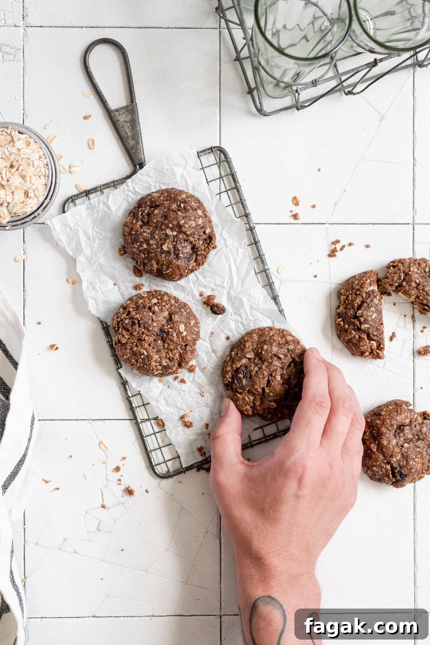 hand grabbing cookie on wire rack