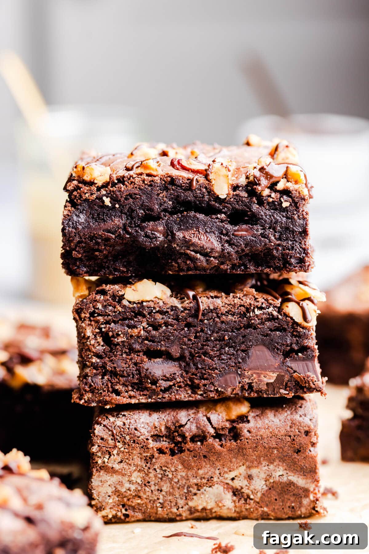 side close up at a stack of three brownies on top of each other