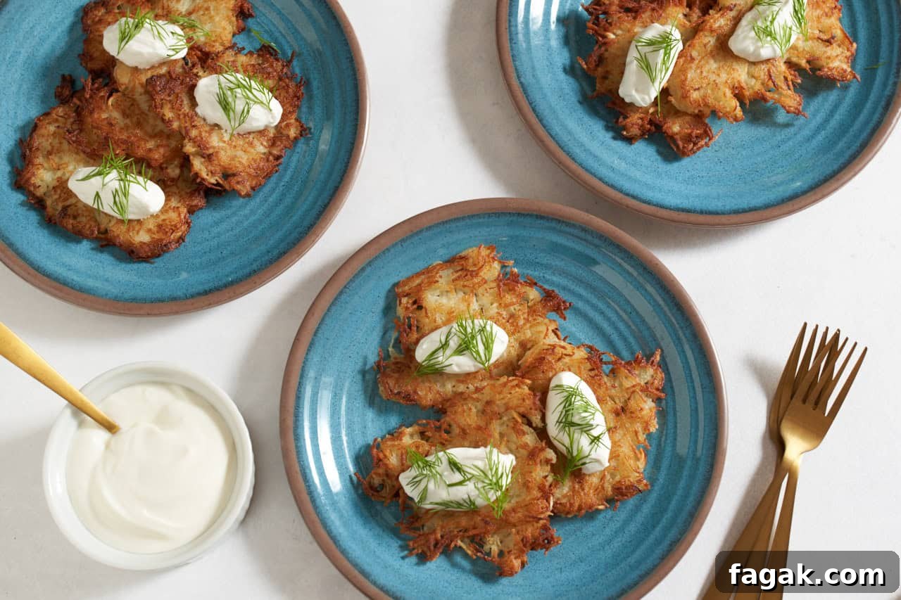 Ukrainian potato pancakes topped with sour cream and dill.