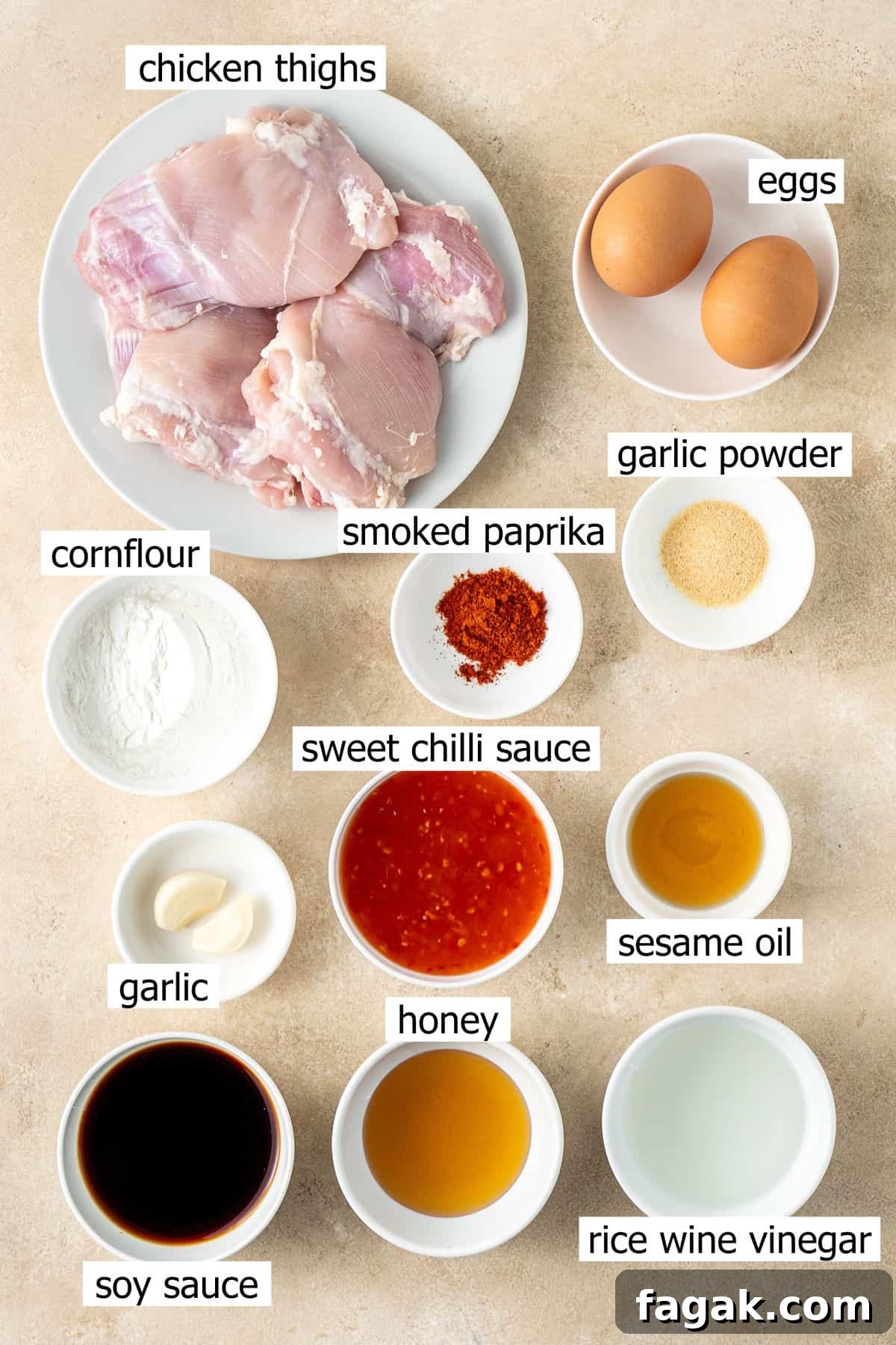 All ingredients needed to make sweet chilli chicken laid out in small bowls.