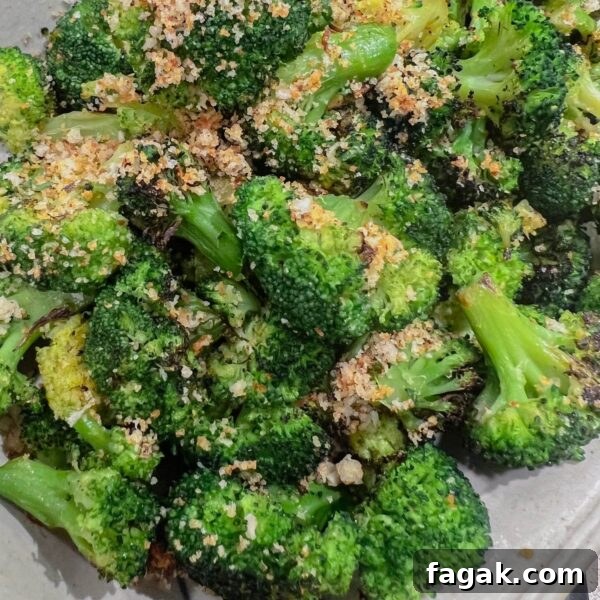 roasted frozen broccoli on grey plate with breadcrumb topping
