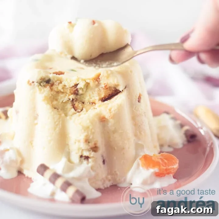 A square photo with a chipolata pudding on a pink plate. A spoon takes a bite.