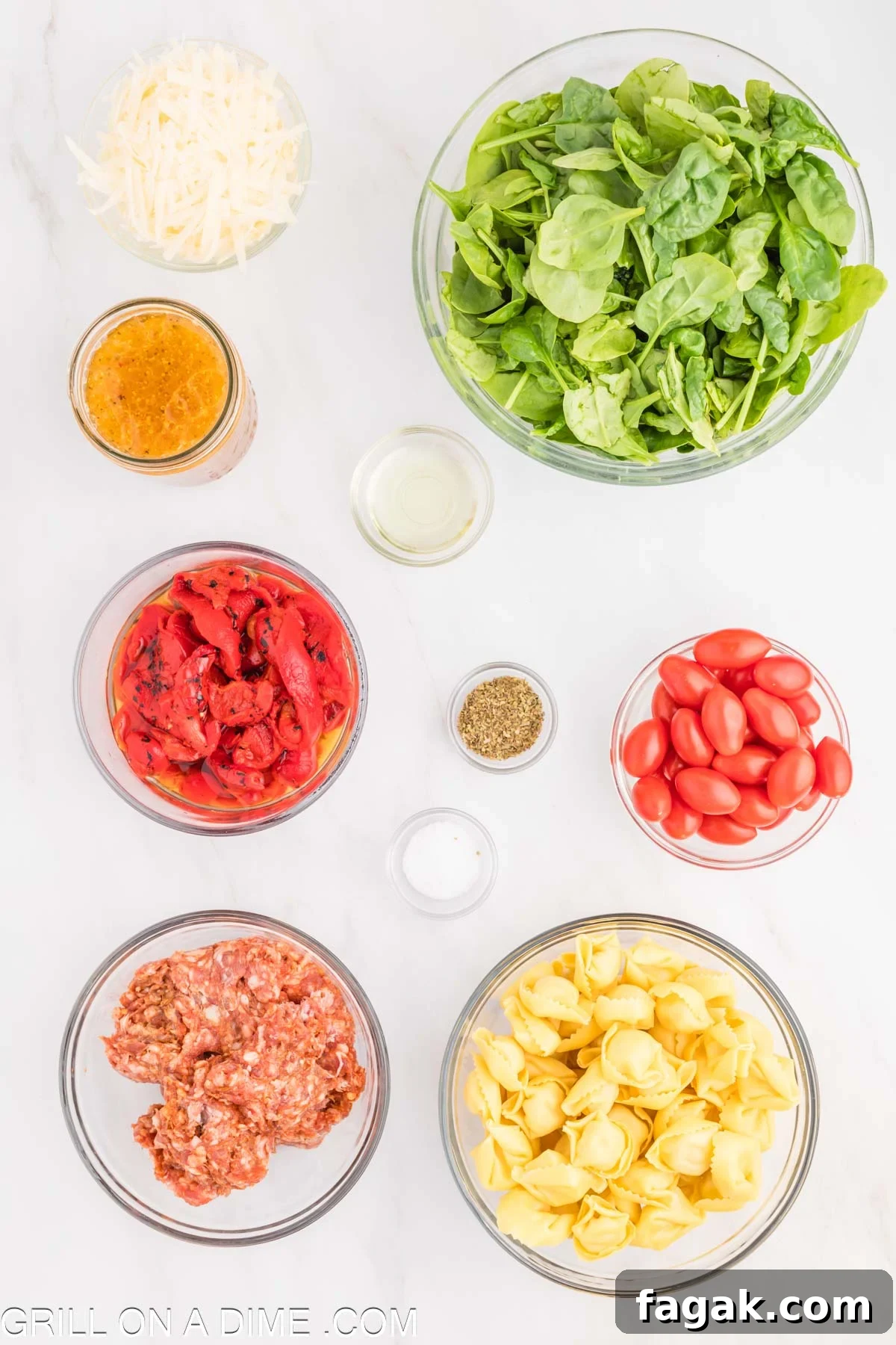 Ingredients needed for Tortellini and Sausage - Avocado Oil, Ground Italian Sausage, Cheese Tortellini, Fresh Spinach, cherry tomatoes, red bell peppers, Italian salad Dressing, salt, dried oregano, parmesan cheese