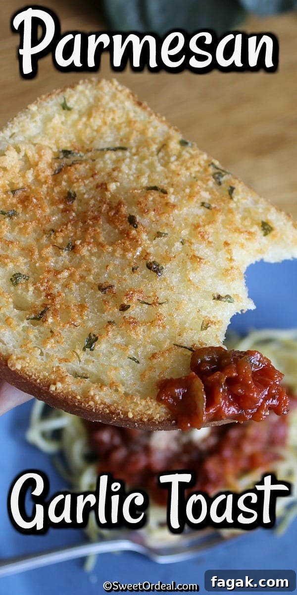 Single slice of Parmesan Garlic Toast dipped in marinara sauce.