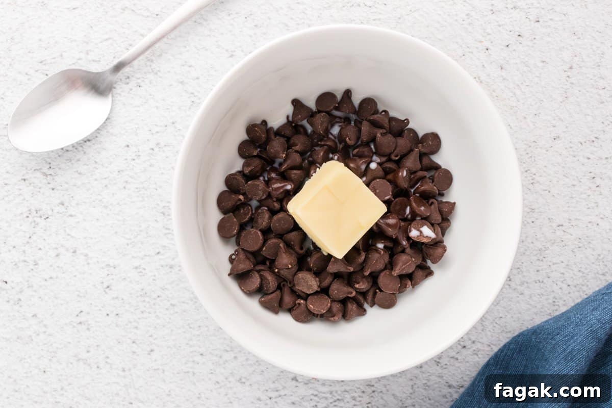 ganache ingredients for banana fudge pie in a white bowl.